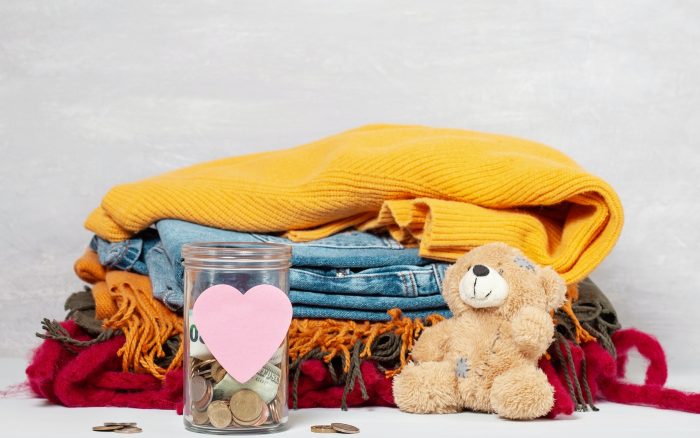 Coins, banknotes in money jar and box with donations